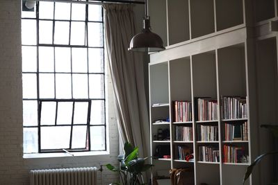 Pendant light hanging in library at home