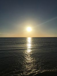 Scenic view of sea against sky at sunset