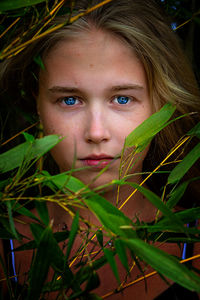 Young women with blue eyes in nature