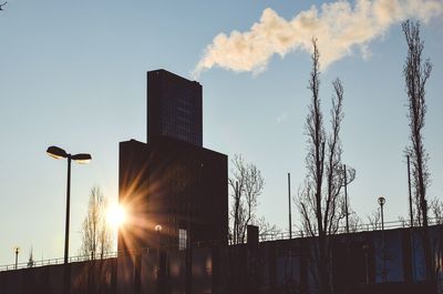 Low angle view of buildings against sky during sunset