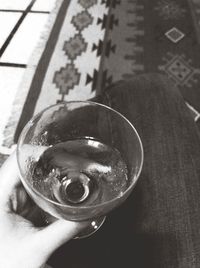 Close-up of person holding beer glass