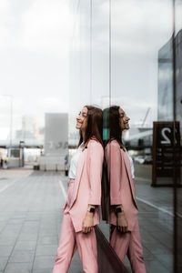 Rear view of women standing in city