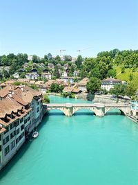 High angle view of river against buildings