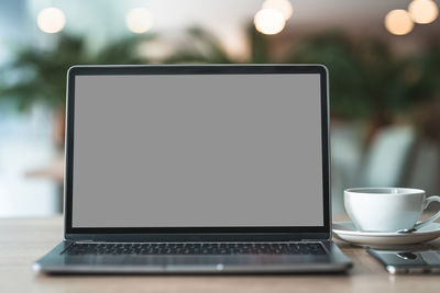 Close-up of coffee cup on table