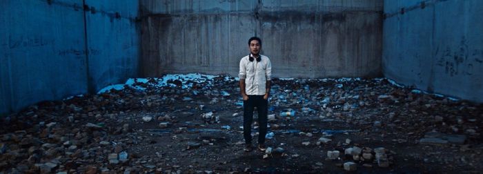 Portrait of young woman standing outdoors