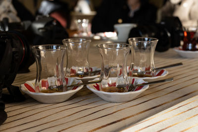 Close-up of wine glasses on table at restaurant