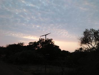 Low angle view of silhouette trees against sky during sunset