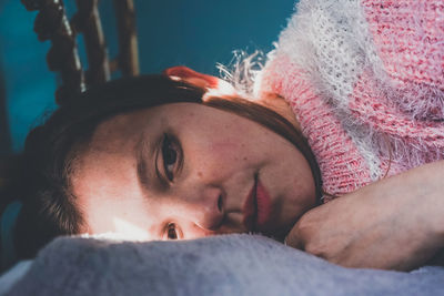 Woman lying on bed