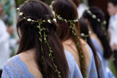 Bridesmaids wearing wreaths during wedding