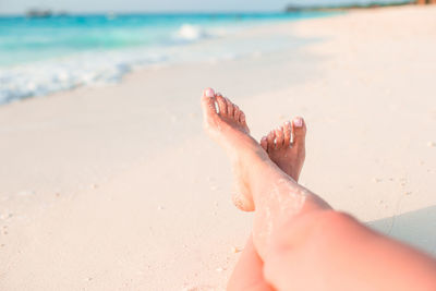 Low section of woman on beach