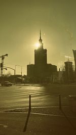 View of city buildings against cloudy sky