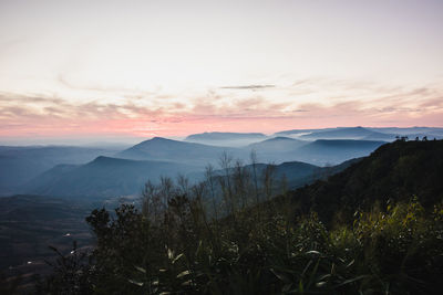 Scenic view of mountains against sky during sunset