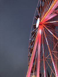 Low angle view of ferris wheel against sky at night