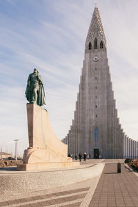 Leif erikson statue at hallgrimskirkja against sky