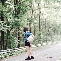 Full length of woman walking on road