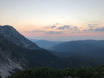 Scenic view of mountains against sky during sunset
