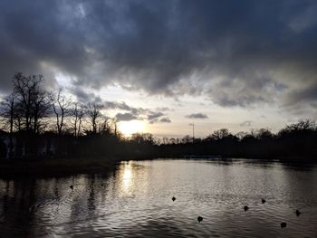 Scenic view of lake against sky during sunset