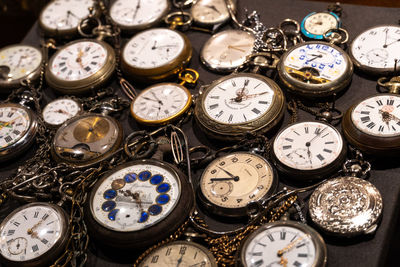 High angle view of pocket watches on table