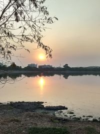 Scenic view of lake against sky during sunset