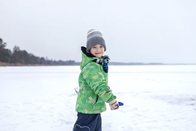 Portrait of boy in snow