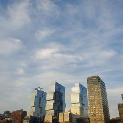 Low angle view of buildings against sky in city