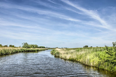 Scenic view of river against sky