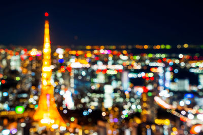 Defocused image of illuminated buildings at night