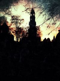 Low angle view of silhouette bare tree against sky at sunset