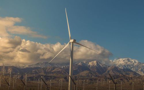 Wind turbine against sky