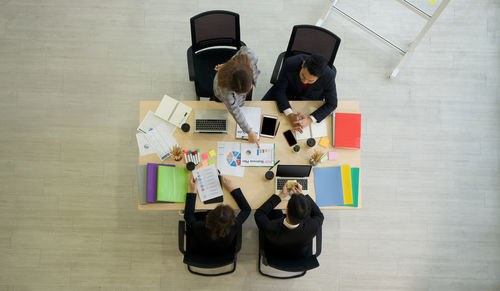 High angle view of people on table