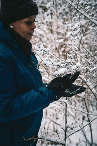 Man standing on snow covered land