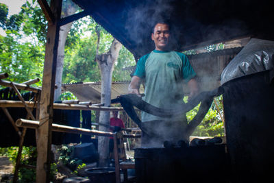  the craftsmen do  dyeing process of the fabric lurik in tringsing village,  java, indonesia