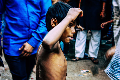 Midsection of man looking at camera