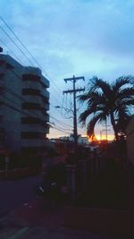 Low angle view of building against sky at sunset