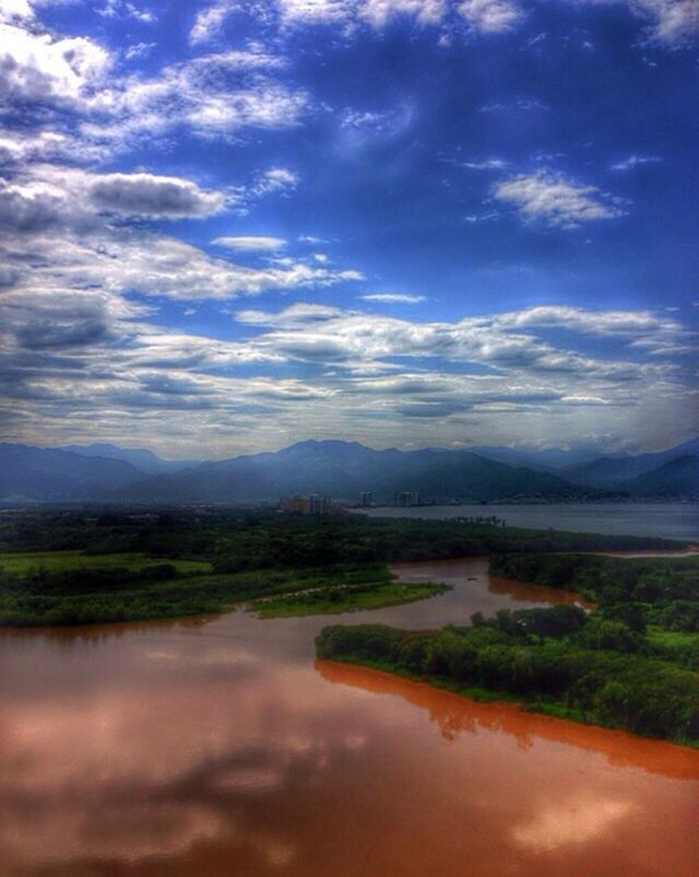 sky, tranquil scene, water, tranquility, scenics, mountain, cloud - sky, lake, beauty in nature, landscape, cloud, nature, reflection, cloudy, mountain range, idyllic, river, tree, non-urban scene, countryside