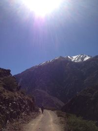 Scenic view of mountain road against clear sky