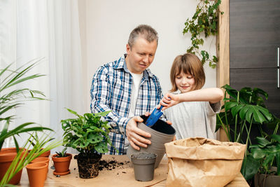 Portrait of cute boy playing with gardening