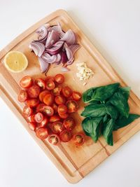 High angle view of chopped vegetables on cutting board