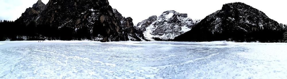 Scenic view of frozen lake against sky during winter