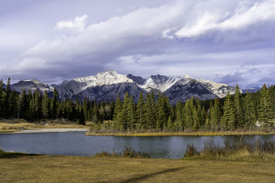 Scenic view of lake and mountains against sky