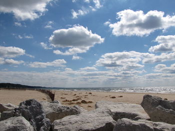 Scenic view of sea against cloudy sky