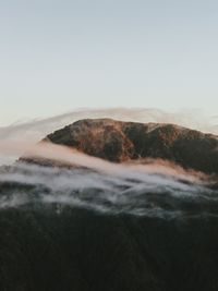 Scenic view of sea against clear sky during sunset