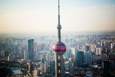 Modern buildings in city against sky