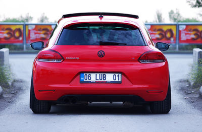 Red vintage car on road