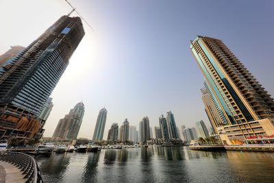 Modern buildings in city against sky