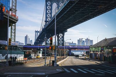 Bridge over city against sky