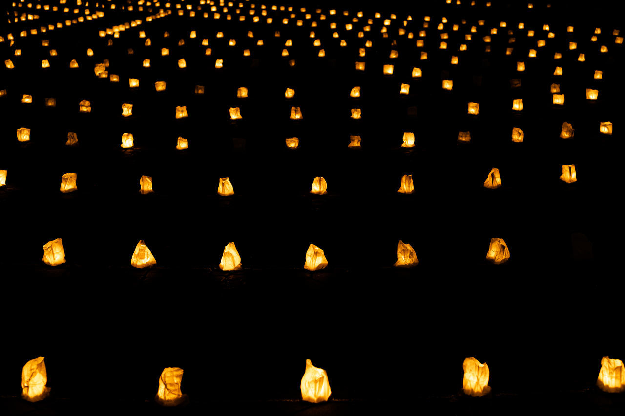 font, large group of objects, illuminated, no people, lighting equipment, in a row, night, abundance, tradition, circle, backgrounds, candle