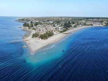 High angle view of swimming pool by sea against clear sky