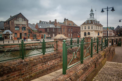 View of buildings against cloudy sky