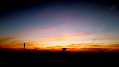 Scenic view of silhouette land against sky during sunset